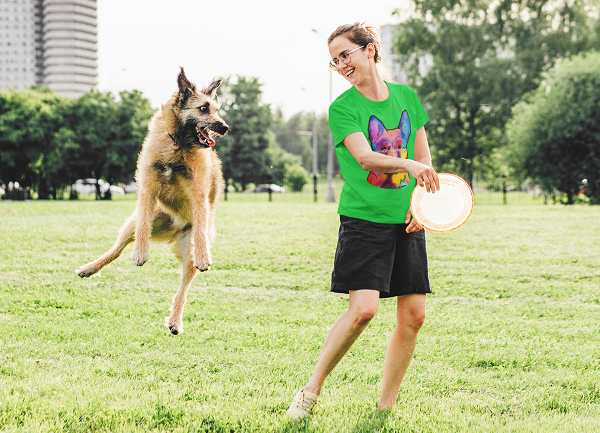 happy woman playing frisbee with her german shepherd 2 600