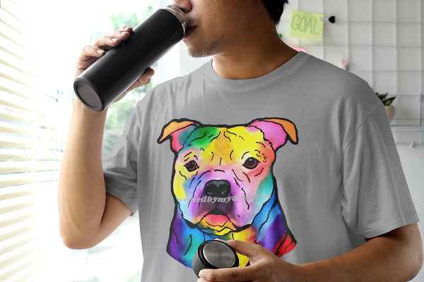 man in a round neck tee drinking from a bottle staffordshire bull terrier 600